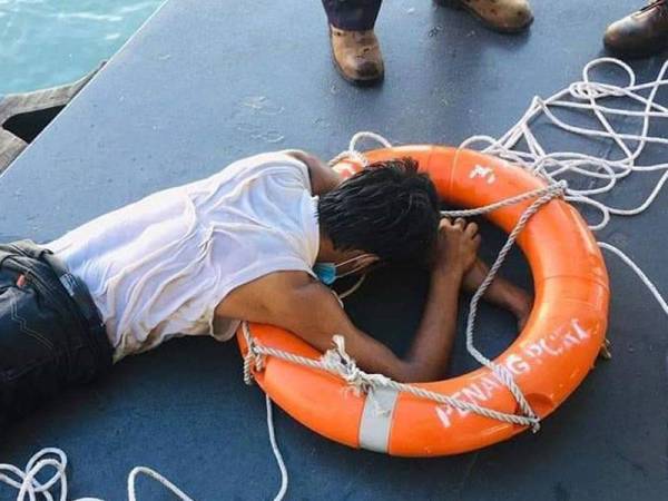 Man attempts to swim across penang straits